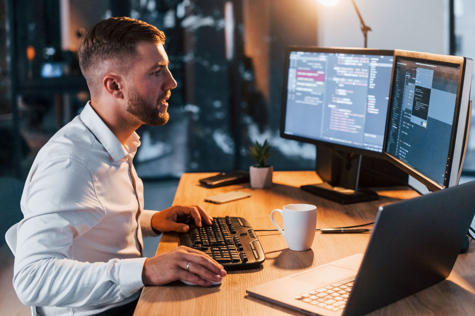 men working with several screens